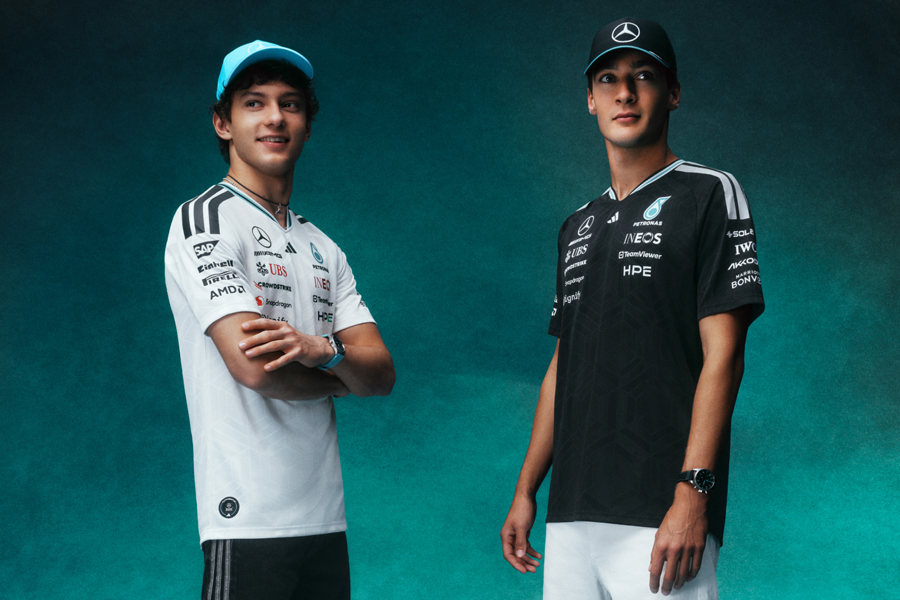 Mercedes-AMG PETRONAS Formula One Team Collection 2026 – powered by adidas zu sehen ist ein Banner der Adidas und das Mercedes-AMG PETRONAS Formula One Team Collection 2026. Verschiedene Models tragen die Team Poloshirts in schwarz und weiß.